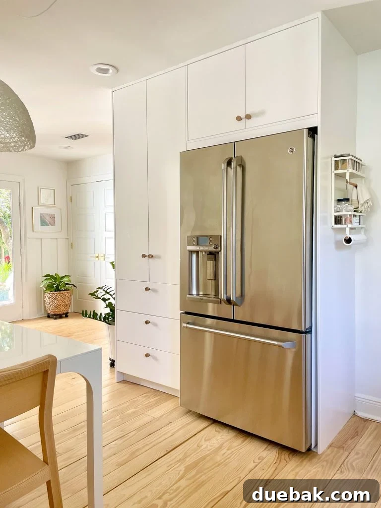Ikea Built-In Pantry Cabinets Around Stainless Steel Refrigerator