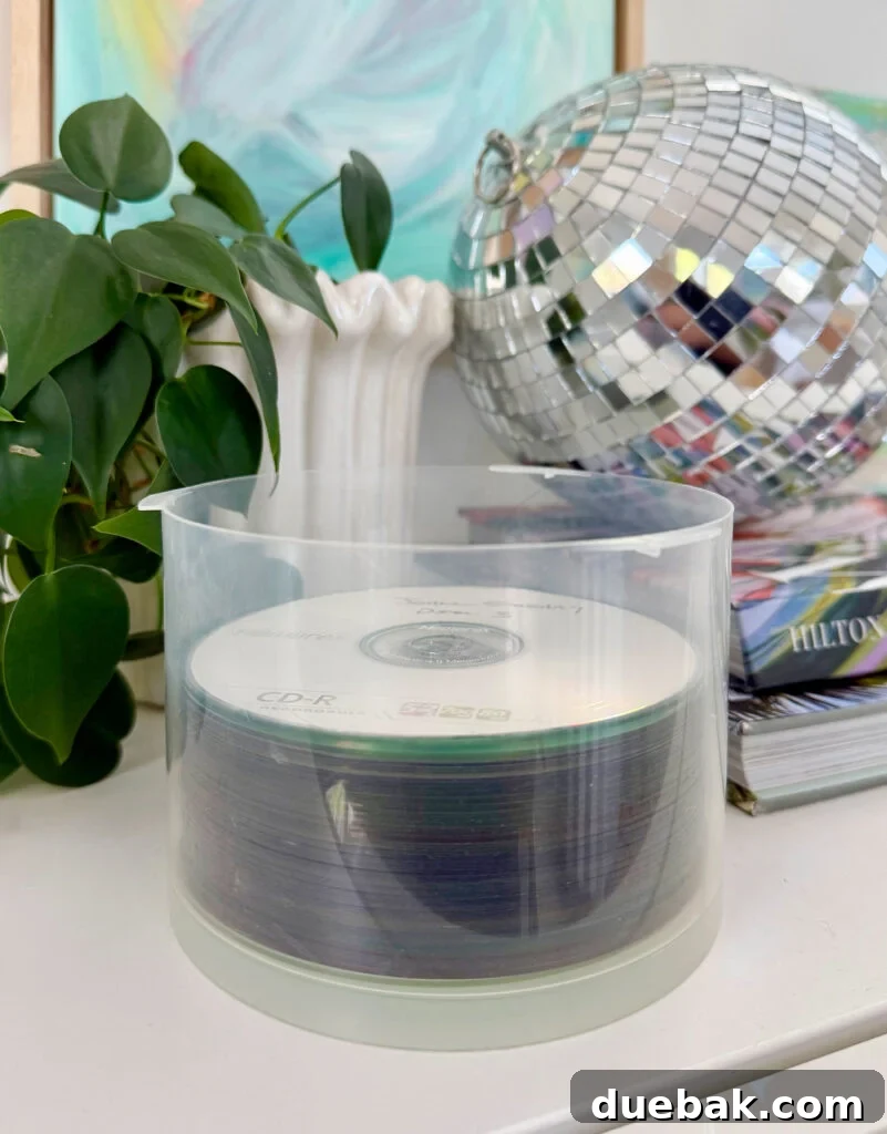 Stack of burned CDs containing old photos